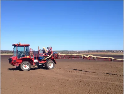 Agribuggy crop sprayer spraying a field of cereals in Yorkshire